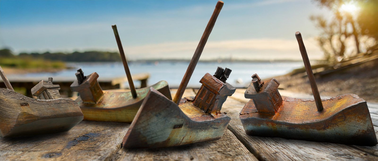 small hand carved wooden fishing boats